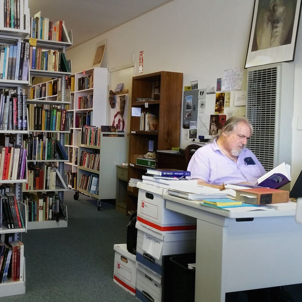 Don Frew catalogs books at the Adocentyn Research Library